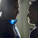 Lee Pace's Empire/Brother Day, wearing his blue armor stands very close to Jared Harris' Hari Seldon in Foundation. Both are shadowed.